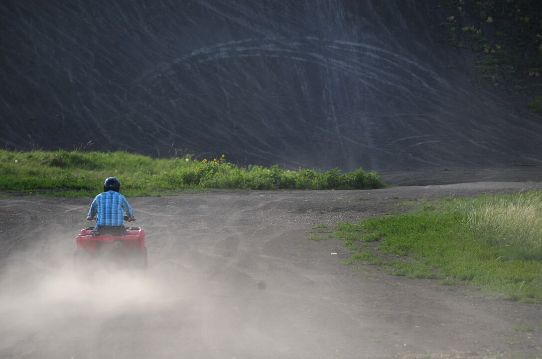 ELLSWORTH AIR FORCE BASE, S.D. -- Airman 1st Class Michael Obringer, 28th Maintenance Squadron aircrew egress systems journeyman, rides an all-terrain vehicle down a trail at the Buffalo Gap National Grasslands, S.D., July 7.  Before riding an ATV, it's important to wear all the proper protective equipment. (U.S. Air Force photo/Airman 1st Class Anthony Sanchelli)