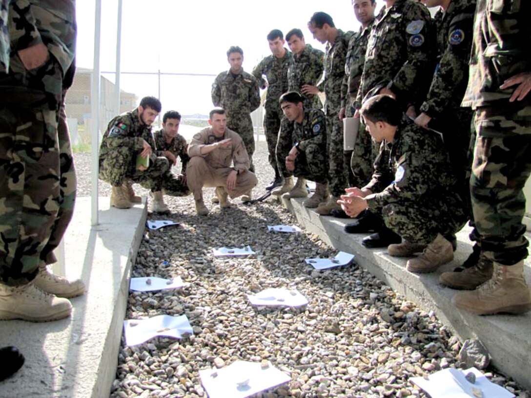 Afghan air force Thunder Lab officers practice communication exercises June 19, 2010 at the Afghan National Army Air Force base in Kabul, Afghanistan.  (U.S. Navy photo/Petty Officer First Class Elizabeth Burke)