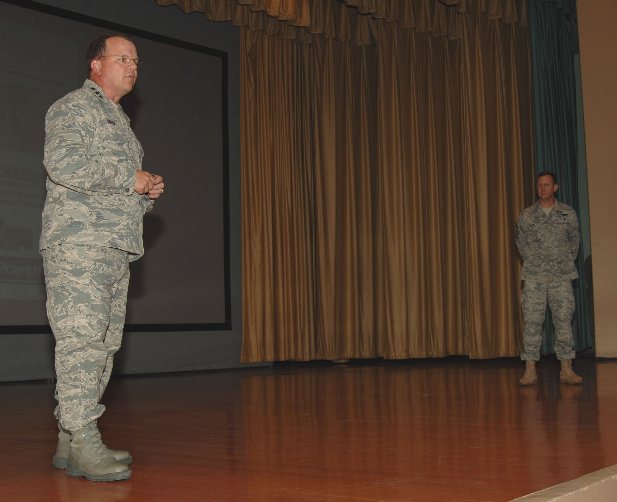 The Surgeon General of the Air Force Lt. Gen. Bruce Green addresses 9th MDG Airmen during an all call at the base theater, July 6. General Green visited Beale to learn about the mission of the 9th Reconnaissance Wing and visit the 9th MDG clinic to see firsthand how the 9th MDG Airmen care for Team Beale. (U.S. Air Force photo by Airman 1st Class Samantha Krolikowski)
