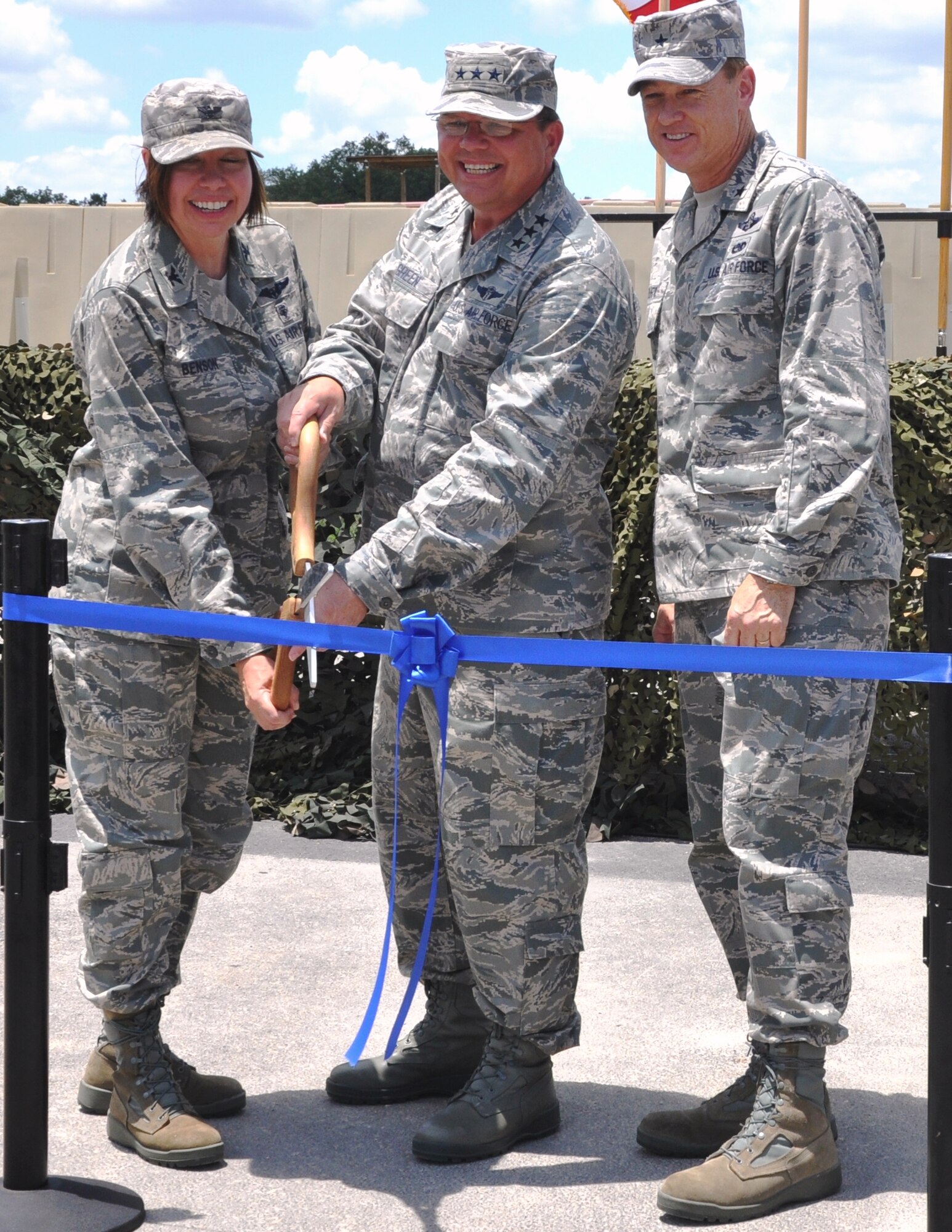 Air Force Col. Lista Benson (left), 882nd Training Group commander; Lt. Gen. (Dr.) Charles Green (center), U.S. Air Force Surgeon General; and Air Force Brig. Gen. Darryl W. Burke, 82nd Training Wing commander, cut the ceremonial ribbon on the new Medical Readiness Training Center at Camp Bullis Friday.  (U.S. Army photo/Steve Elliot)