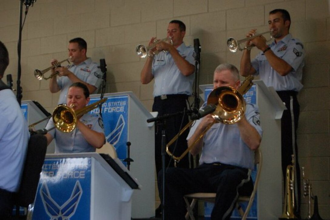 The brass section of Dimensions in Blue entertains the crowd during a Dimensions in Blue performance in Fredericksburg, TX on July 4, 2010.