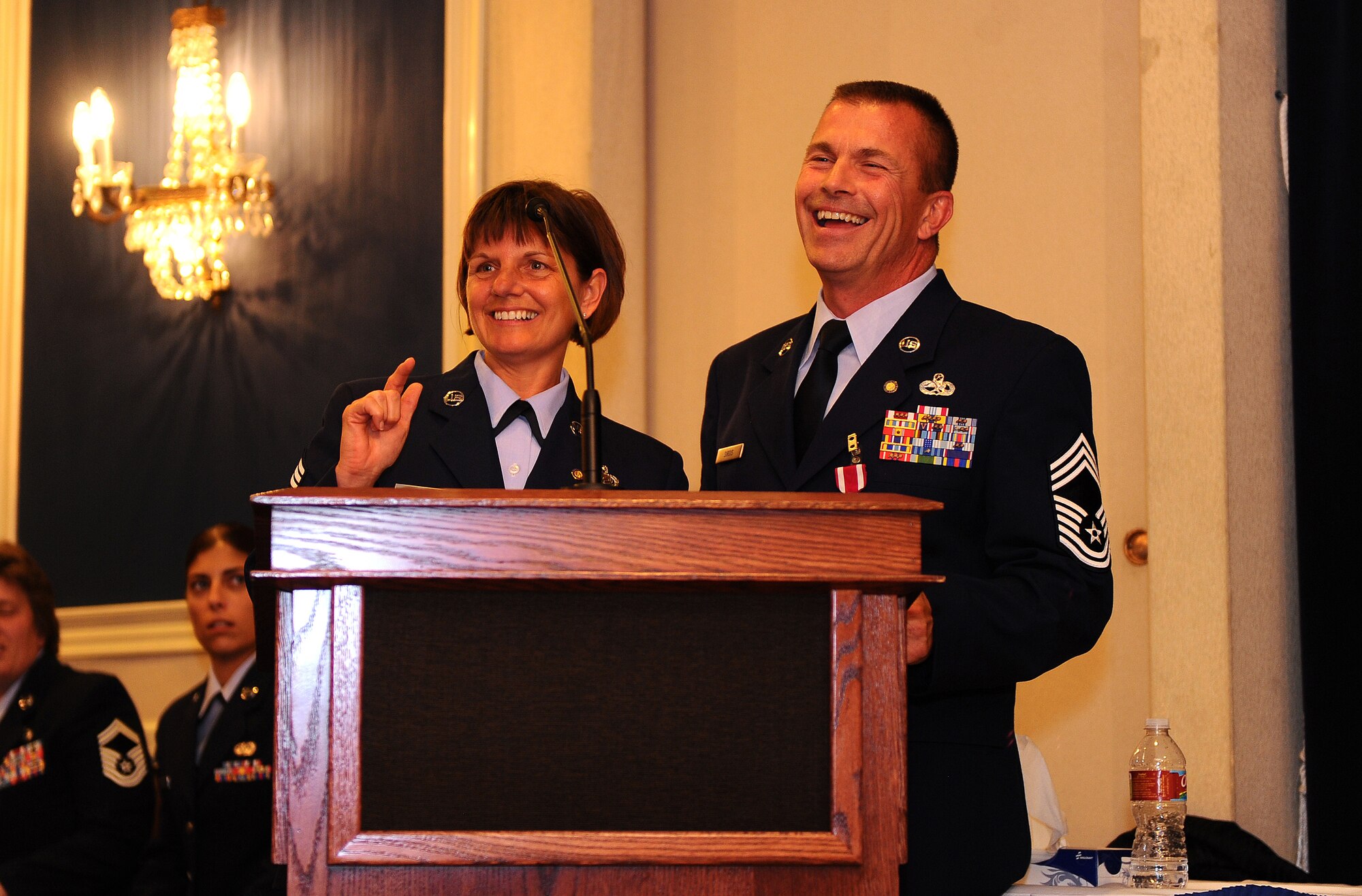 OFFUTT AIR FORCE BASE, Neb. - Command Chief Master Sgt. Lisa Sirois and her husband, Chief Master Sgt. Roger Sirois, are all smiles while they thank those in attendance at their dual retirement ceremony at the Patriot Club, July 6.  With over 60 years of combined service, Chiefs Lisa and Roger Sirois' retirement ceremony symbolized both a commitment to the service of this country as well as one another.
U.S. Air Force Photo by Josh Plueger
