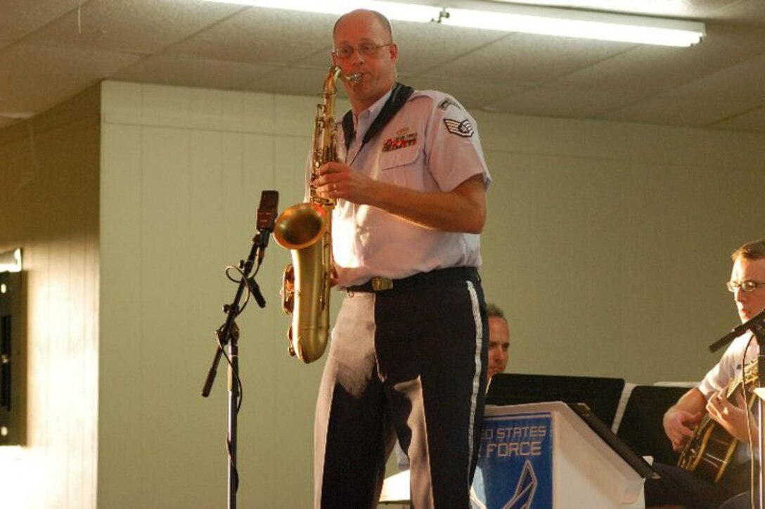 Staff Sergeant Rob Karns entertains the audience on tenor saxophone during a Dimensions in Blue performance in Fredericksburg, TX on July 4, 2010.