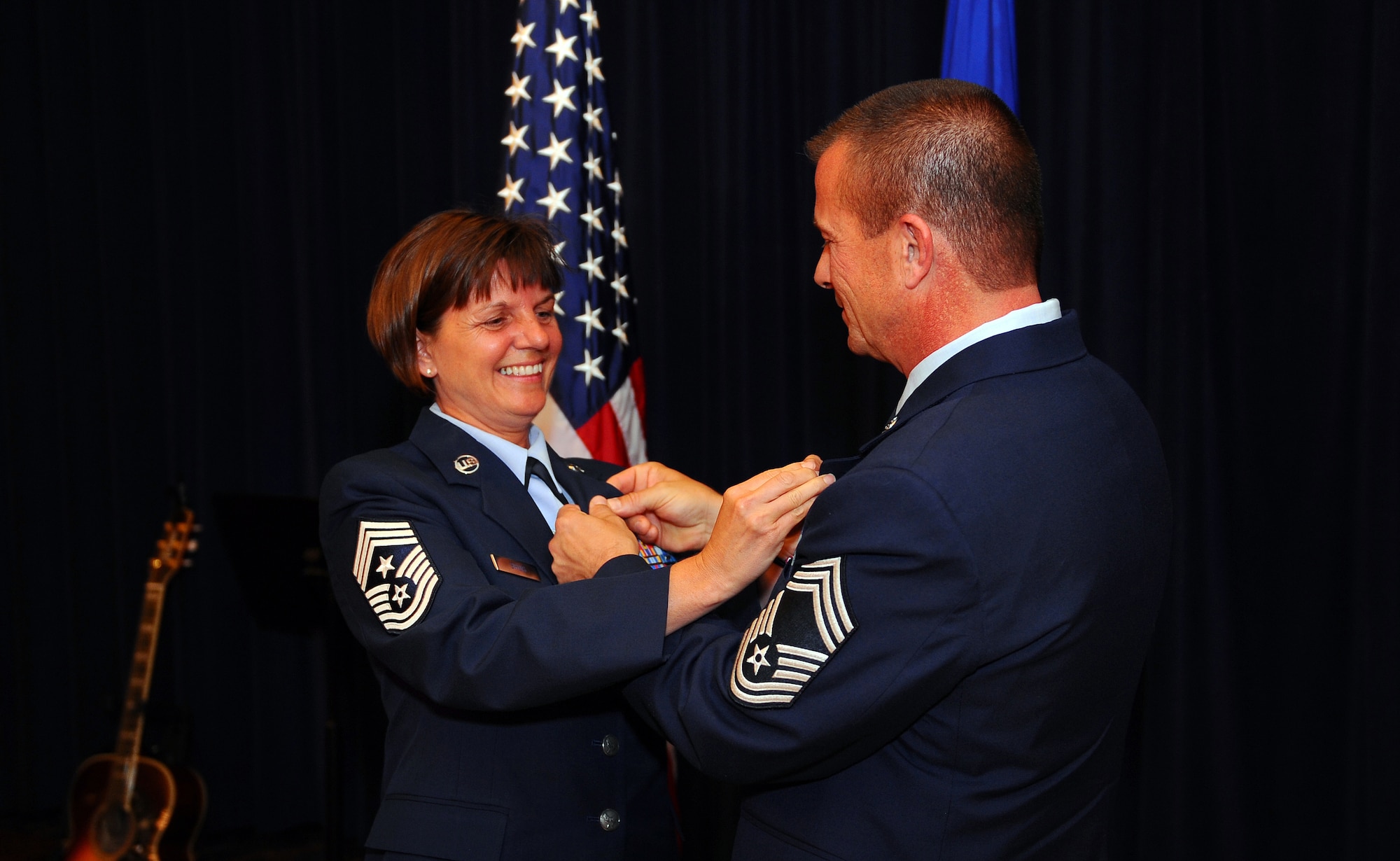 OFFUTT AIR FORCE BASE - Command Chief Master Sgt. Lisa Sirois and her husband, Chief Master Sgt. Roger Sirois, attach Air Force retirement pins to one another's lapels during a dual retirement ceremony at the Patriot Club, July 6. With over 60 years of combined service, Chiefs Lisa and Roger Sirois' retirement ceremony symbolized both a commitment to the service of this country as well as one another.
U.S. Air Force photo by Josh Plueger
