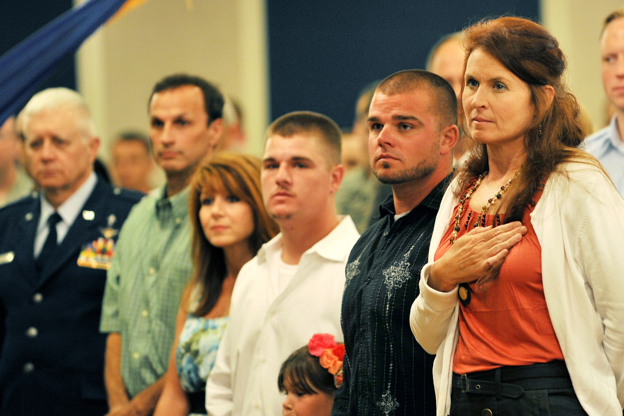 OFFUTT AIR FORCE BASE, Neb. - Laura Shanahan, wife of 55th Wing Commander Brig. Gen. John N.T. Shanahan, and the Sirois family honor the flag at Chief Master Sgts. Lisa and Roger Sirois' retirement ceremony at the Patriot Club July 6. Chiefs Lisa and Roger Sirois celebrated a combined 60 years of service to the United States Air Force that spanned their 30 year marriage. 

U.S. Air Force photo by Charles Haymond