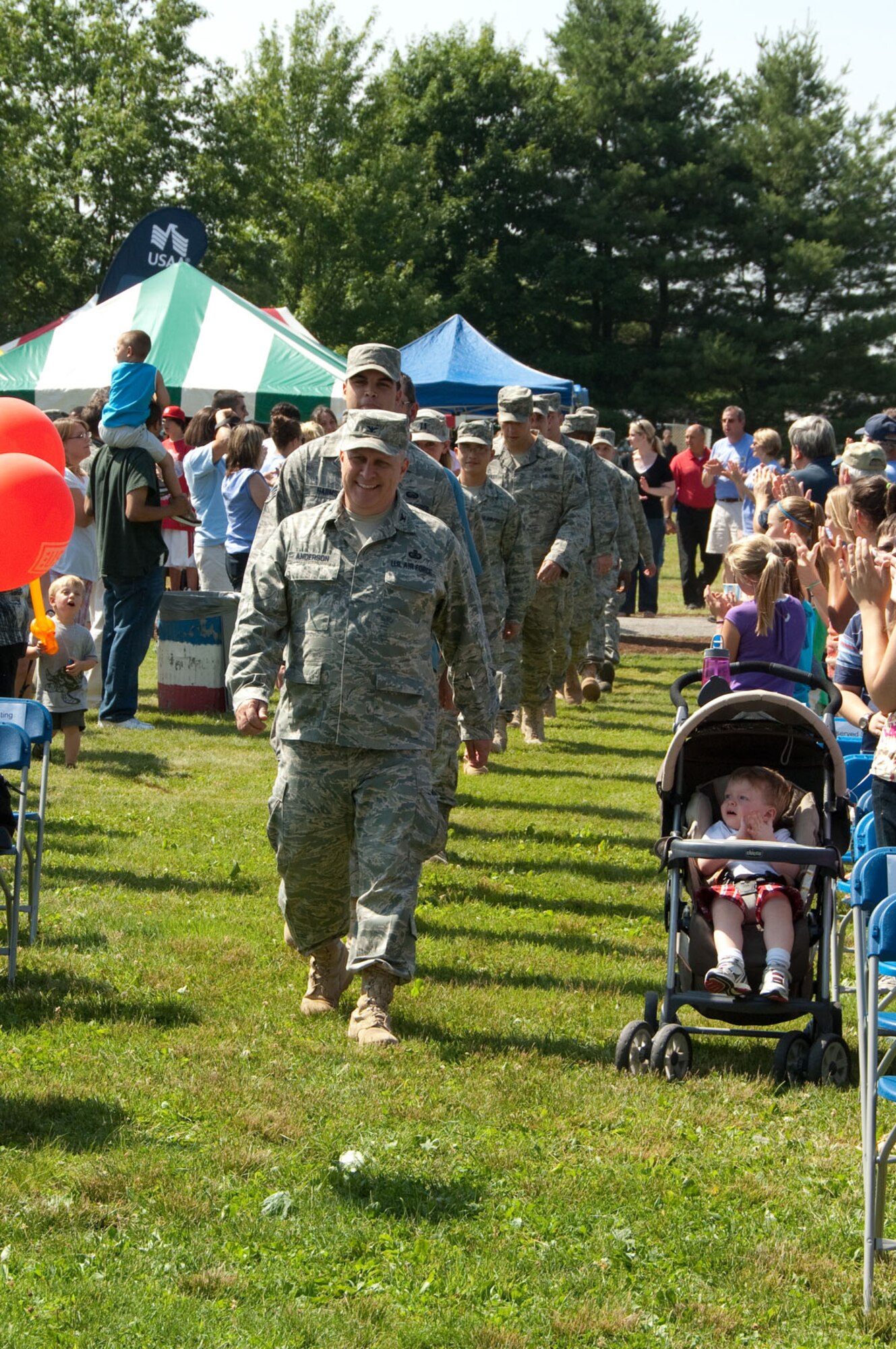 HANSCOM AIR FORCE BASE, Mass. – Col. Douglas Anderson leads in the heroes during Heroes Homecoming. Nearly 40 Airmen who have recently returned from deployments and their families were honored during the ceremony on June 25 at Memorial Park. (U.S. Air Force photo by Rick Berry)