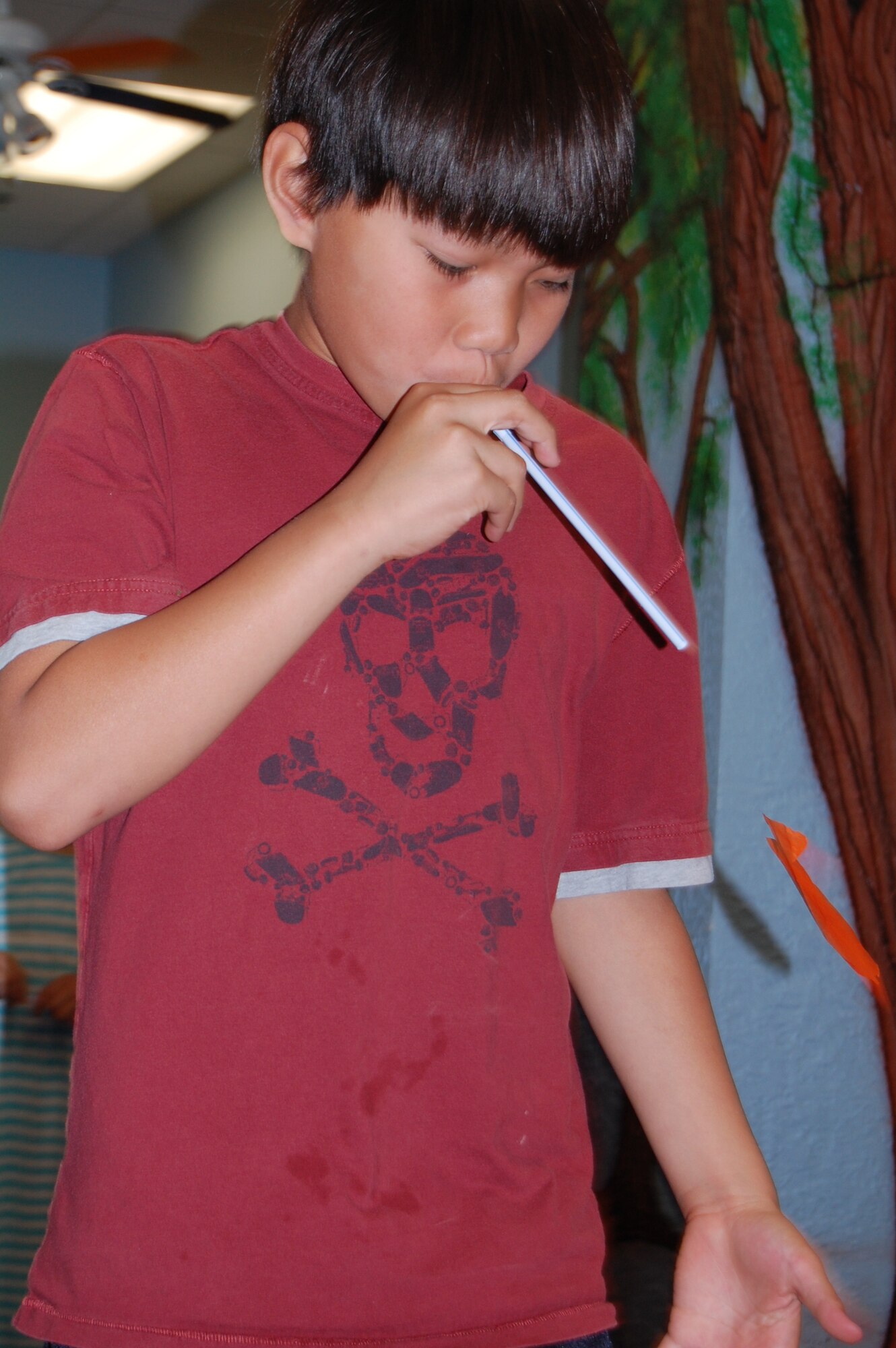 LAUGHLIN AIR FORCE BASE, Texas – A paper fish floats away from Maui Oyala during a fish race at the “Go Fish” summer reading program event July 6 at the Laughlin library. The kid’s summer reading program meets every Tuesday through Aug. 3 and revolves around the theme “Voyage to Book Island”. During the program, the kids participate in several different activities and have a snack in addition to a book being read aloud to them. (U.S. Air Force Photo by Staff Sgt. Desiree Economides)