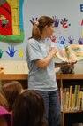 LAUGHLIN AIR FORCE BASE, Texas – Tricia Ross, 47th Force Support Squadron, reads aloud to children during the July 6 “Go Fish” reading event at the Laughlin library. The kid’s summer reading program meets every Tuesday through Aug. 3 and revolves around the theme “Voyage to Book Island”. During the program, the kids participate in several different activities and have a snack in addition to a book being read aloud to them. (U.S. Air Force Photo by Staff Sgt. Desiree Economides)