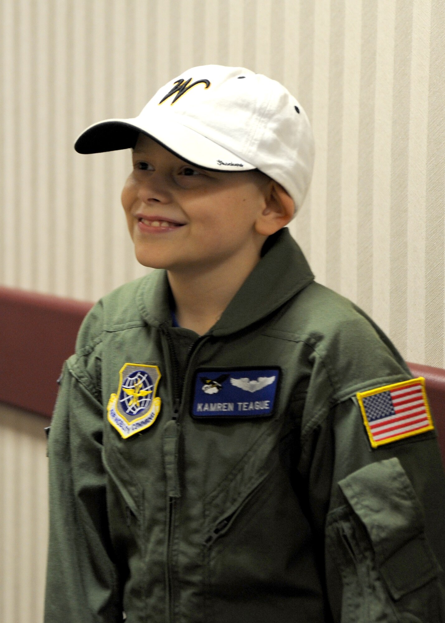 Kamren Teague, a 9-year-old from Wichita, Kan., who was recently diagnosed with Lymphoma, smiles as he becomes a member of the 344th Air Refueling Squadron as part of the “Pilot for a Day” program, June 30, 2010, McConnell Air Force Base, Kan.  Airmen from the 344th ARS hosted Kamren and his family, helping them learn about McConnell’s flying operations, ensuring Kamren had a day to remember.  The family also toured a KC-135 Stratotanker, a fire truck and the air traffic control tower.  (U.S. Air Force photo/Airman 1st Class Andrea Salazar)