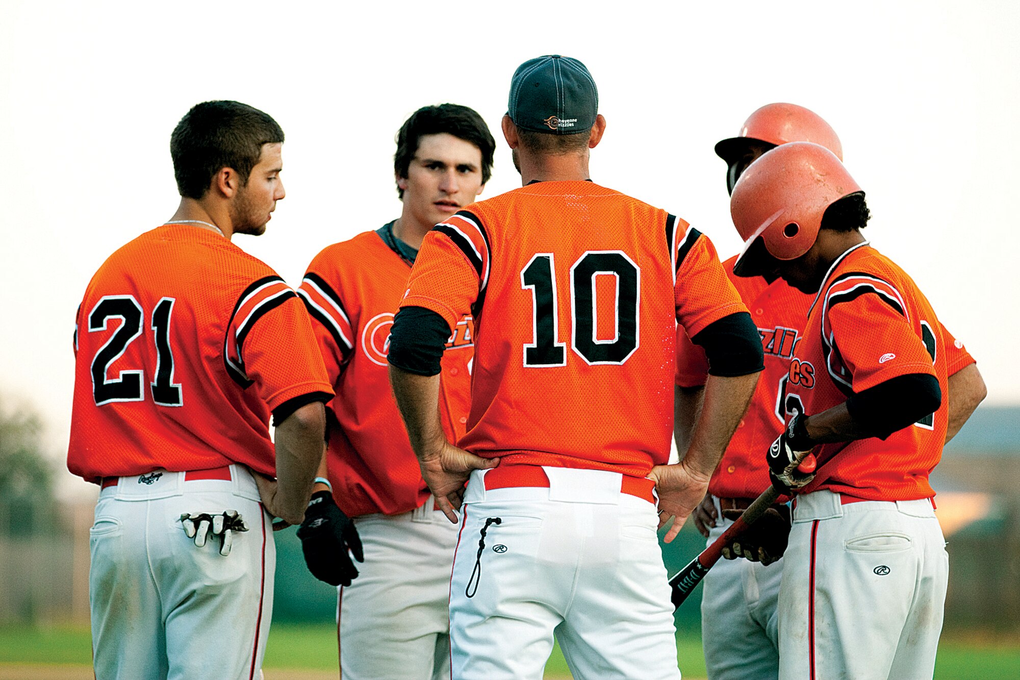 Cheyenne Grizzlies teammates gather for a moment to regroup after the Laramie Colts scored several runs during their game June 24. The regrouping worked as the Cheyenne Grizzlies went on to beat the Laramie Colts 10-8. (U.S. Air Force photo by Jeff Allred)