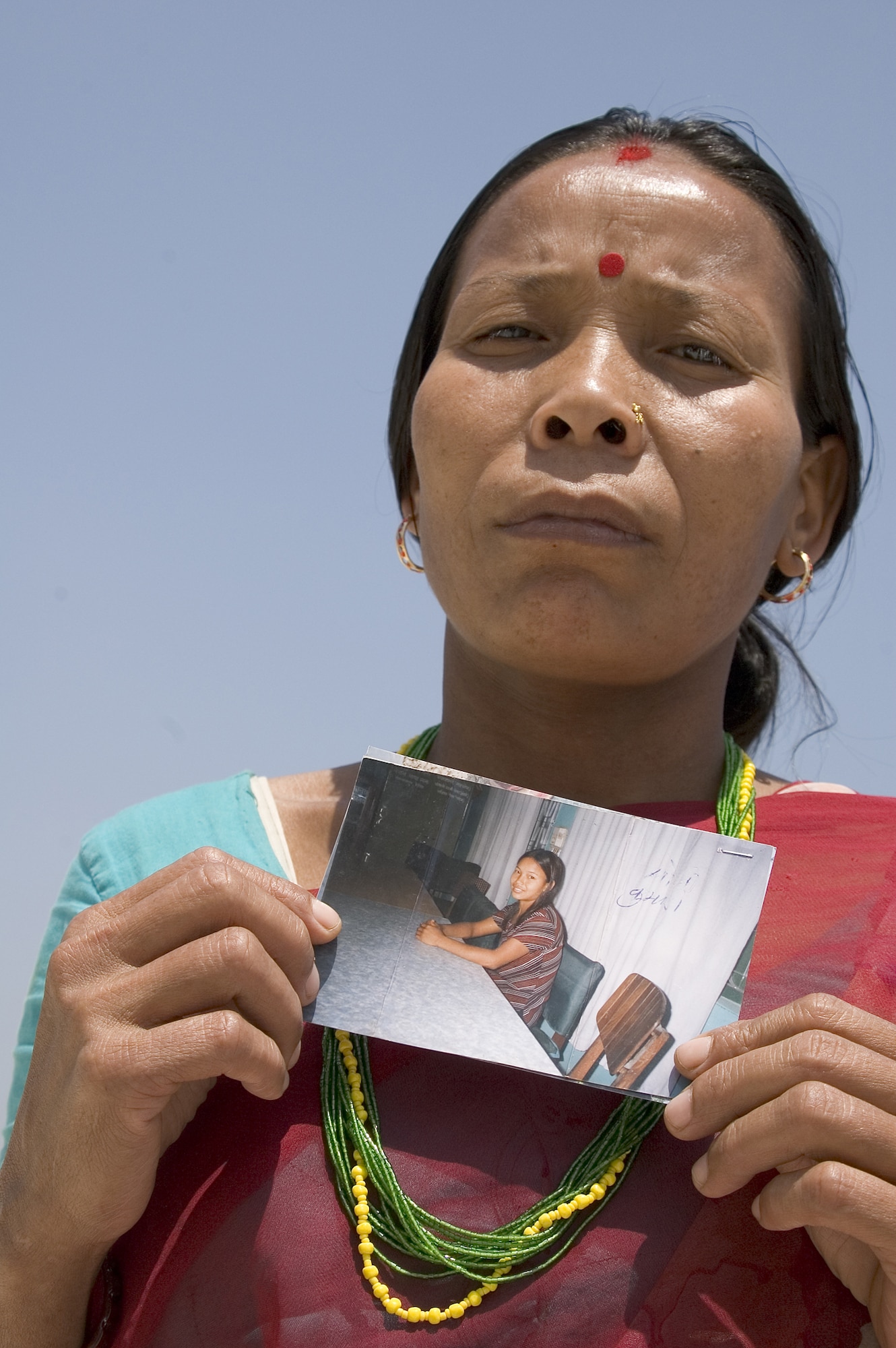 This desperate mother traveled from her village in Nepal to Mumbai, India, hoping to find and rescue her teenage daughter who was trafficked into an Indian brothel. Nepalese girls are prized for their fair skin and are lured with promises of a "good" job and the chance to improve their lives. The Air Force has a strict zero tolerance policy for human trafficking. (Photo by Kay Chernush for the U.S. State Department)