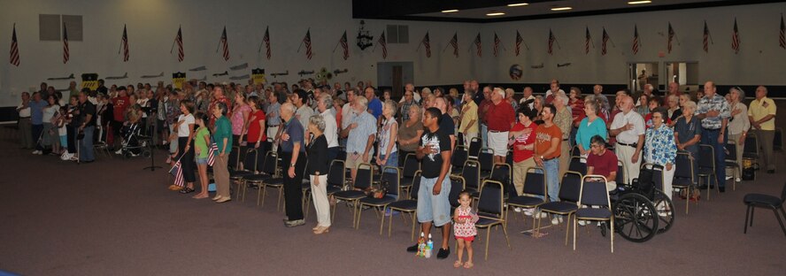 BARKSDALE AIR FORCE BASE, La. – More than 300 Barksdale community members stand and place their hand over their heart as the Shreveport Metropolitan Concert Band plays the National Anthem. (U.S. Air Force photo by Senior Airman Alexandra M. Boutte) (RELEASED)