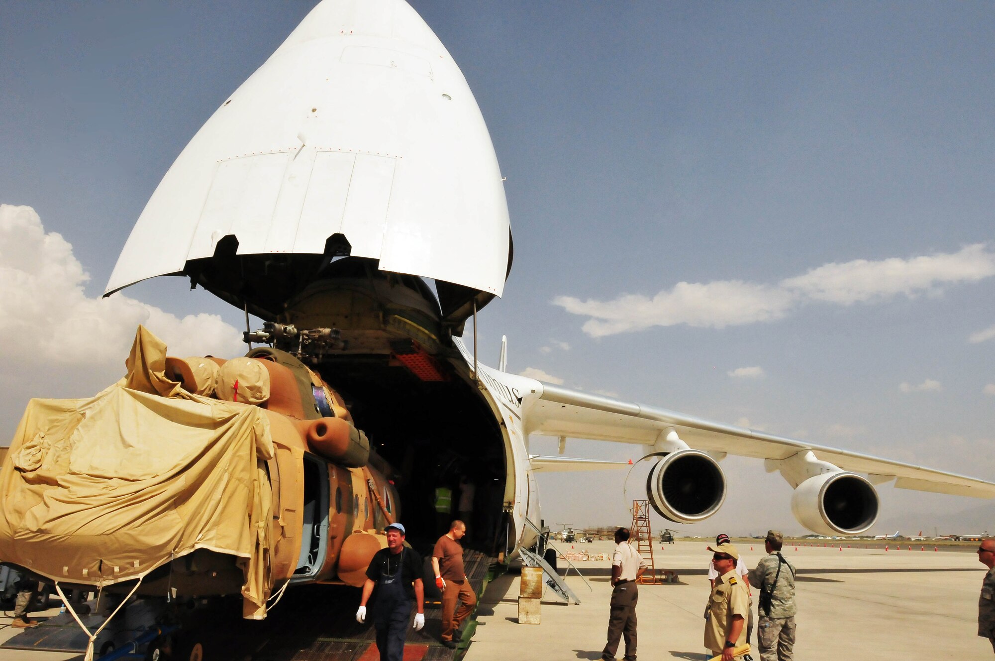 100708-N-6031Q-009 KABUL, Afghanistan -- The Afghan Air Force with help from the Combined Air Power Transition Force, receive two new Mi-17 helicopters on July 8, 2010. The helicopters were delivered by an An-124 strategic airlift jet airplane named by NATO as a "Condor".(US Navy photo by Mass Communication Specialist 2nd Class David Quillen/ RELEASED).