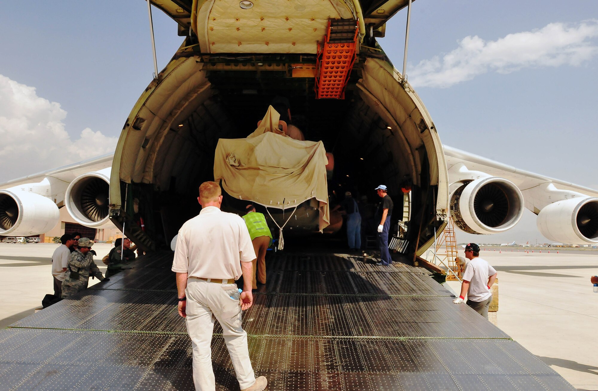 100708-N-6031Q-007 KABUL, Afghanistan -- The Afghan Air Force with help from the Combined Air Power Transition Force, receive two new Mi-17 helicopters on July 8, 2010. The helicopters were delivered by an An-124 strategic airlift jet airplane named by NATO as a "Condor".(US Navy photo by Mass Communication Specialist 2nd Class David Quillen/ RELEASED).