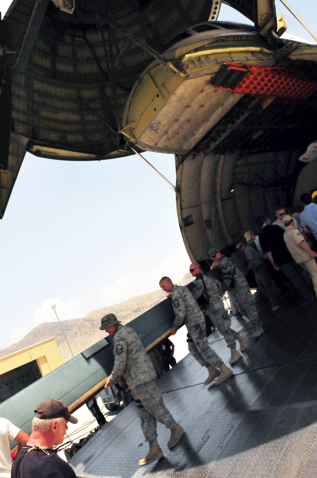 100708-N-6031Q-005 KABUL, Afghanistan -- The Afghan Air Force with help from the Combined Air Power Transition Force, receive two new Mi-17 helicopters on July 8, 2010. The helicopters were delivered by an An-124 strategic airlift jet airplane named by NATO as a "Condor".(US Navy photo by Mass Communication Specialist 2nd Class David Quillen/ RELEASED).
