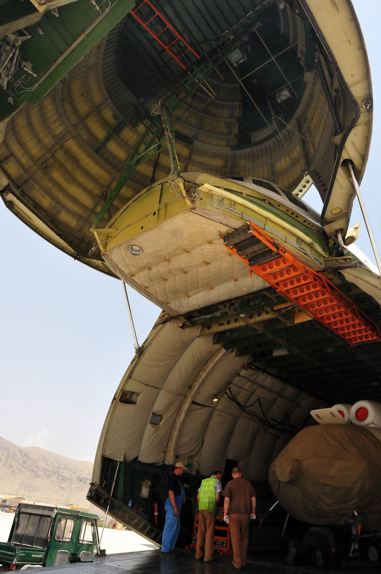 100708-N-6031Q-004 KABUL, Afghanistan -- The Afghan Air Force with help from the Combined Air Power Transition Force, receive two new Mi-17 helicopters on July 8, 2010. The helicopters were delivered by an An-124 strategic airlift jet airplane named by NATO as a "Condor".(US Navy photo by Mass Communication Specialist 2nd Class David Quillen/ RELEASED).