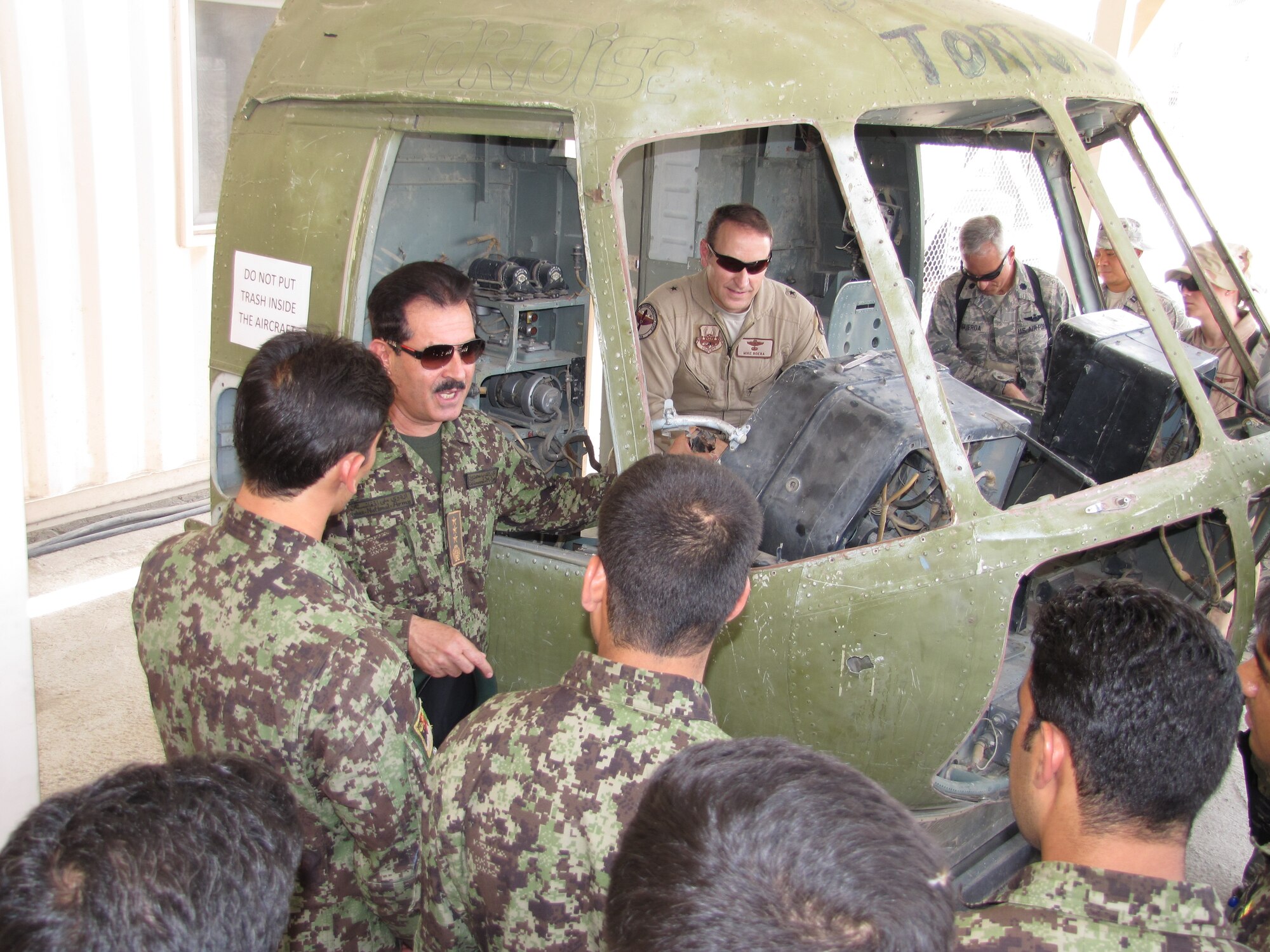 KABUL, Afghanistan – Brig. Gen. Boera, the Commanding General, Combined Air Power Transition Force, NATO Training Mission-Afghanistan/Combined Security Transition Command-Afghanistan, and Commander, 438th Air Expeditionary Wing and Maj. Gen. Darwan, Afghan Air Force commander, tour the Afghan Air Force Thunder Lab, an English immersion program designed to improve the English, aviation and professional skills of Afghan Air Force officers awaiting pilot training on July 8, 2010.  (U.S. Air Force photo by Capt. Rob Leese/RELEASED).