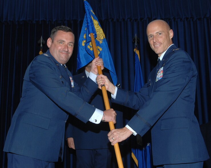 Maj. Thomas D. Ausherman (right) accepts command of the 39th Force Support Squadron from Col. Andrew H. Pears (left), 39th Mission Support Group commander, during a change of command ceremony, July 7, 2010 at Incirlik Air Base, Turkey.  Major Ausherman came to Incirlik from the Air Command and Staff College, Maxwell Air Force Base, AL.  The change of command ceremony is an Air Force tradition that gives unit Airmen the opportunity to see the new leader take command.  (U.S. Air Force Photo/Tech. Sgt. Valda Wilson)