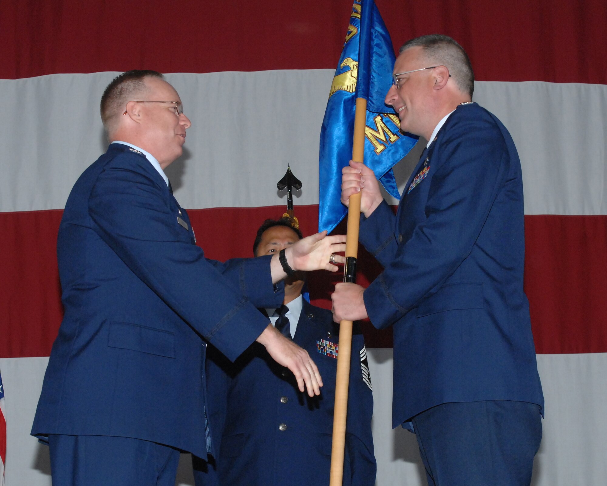 Col. Jay S. Cloutier (right) accepts command of the 39th Medical Group from Col. Eric A. Beene (left), 39th Air Base Wing commander, during a change of command ceremony, July 7, 2010 at Incirlik Air Base, Turkey.  Colonel Cloutier came to Incirlik after serving as the Commander of the 86th Medical Operations Squadron, Ramstein Air Base, Germany.  (U.S. Air Force Photo/Tech Sgt. Valda Wilson)
