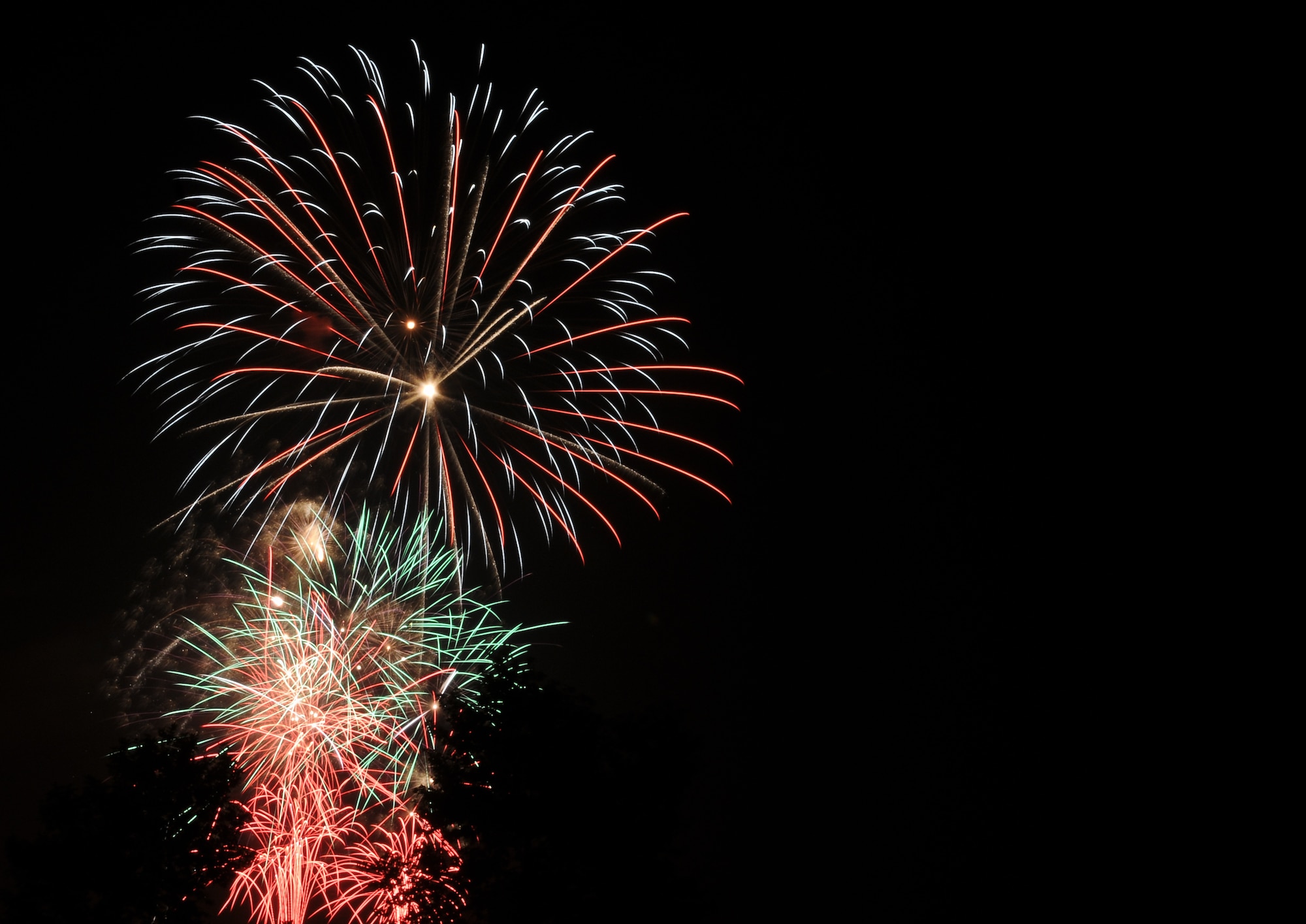 Fireworks explode above the trees during the base’s Independence Day celebration July 4, 2010 at Incirlik Air Base, Turkey. Arkadas Park was filled with events, music and food that helped base members celebrate the holiday. (U.S. Air Force photo/Senior Airman Alexandre Montes)