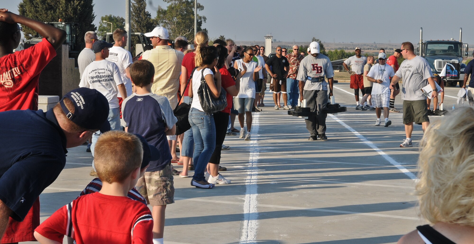 Incirlik members cheer on competitors for the “farmer’s carry” during the Strongman Challenge July 4, 2010 Incirlik Air Base, Turkey. A farmer’s carry consist of each arm carrying weight to and from a set point. This year Incirlik introduced its first Strongman Challenge with three weight classes and five events. (U.S. Air Force photo/Senior Airman Alexandre Montes)