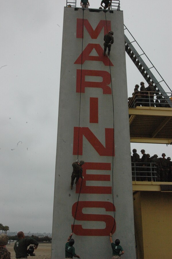 Company H recruits descend the 60-foot rappel tower. Before the recruits go to the rappel tower, they are given classes on how to properly descend and secure their safety harnesses.