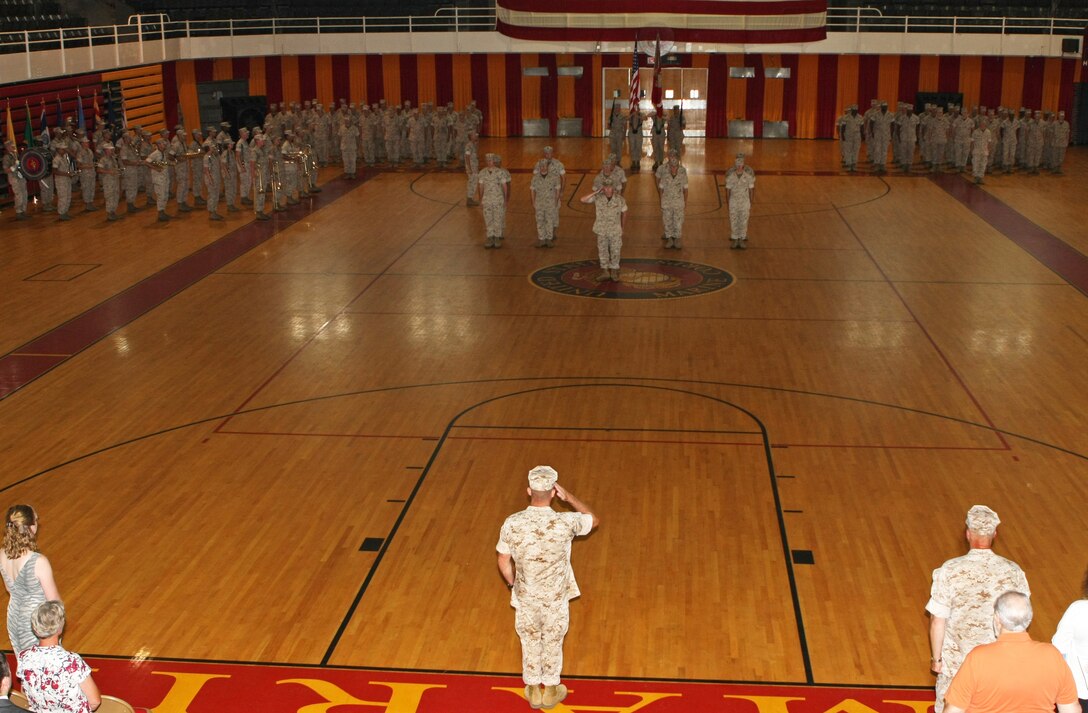 Colonel Eric J. Steidl, commanding officer for the 22nd Marine Expeditionary Unit, salutes the MEU Marines for the first time, during a change of command ceremony with Col. Gareth F. Brandl at the Goettge Field House aboard Camp Lejeune, N.C. July 8, 2010.  For 27 months, Col. Brandl served as the commanding officer for the MEU, and is now heading to Norfolk, Va. for his next duty assignment.  Colonel Steidl's former billet was the Senior United States Marine Corps Readiness Analyst for the Office of the Secretary of Defense.
