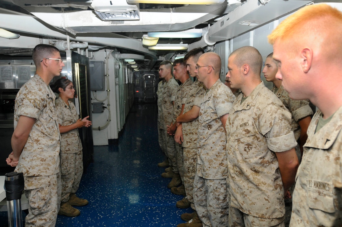 Marines embarked aboard the amphibious transport dock ship USS Ponce hold quarters to discuss the 26th Marine Expeditionary Unit (MEU) coming onboard the ship. Ponce is currently participating in composite training unit exercise (COMPTUEX) to prepare for deployment scheduled for later this year. (US Navy Photo by Mass Communication Specialist Seaman Scott Pittman/Released)