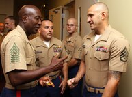 CHICAGO—Sgt. Maj. of the Marine Corps Carlton W. Kent speaks with Staff Sgt. Anthony Cimbaro, noncommissioned officer in charge of Recruiting Substation Chain of Lakes, Il, regarding the recent June accomplishments for the RS here July 9. Kent spoke with the Marines of RS Chicago and thanked them for their hard work and dedication to the future of the Corps. (U.S. Marine Corps photo by Sgt. George J. Papastrat) (Released)