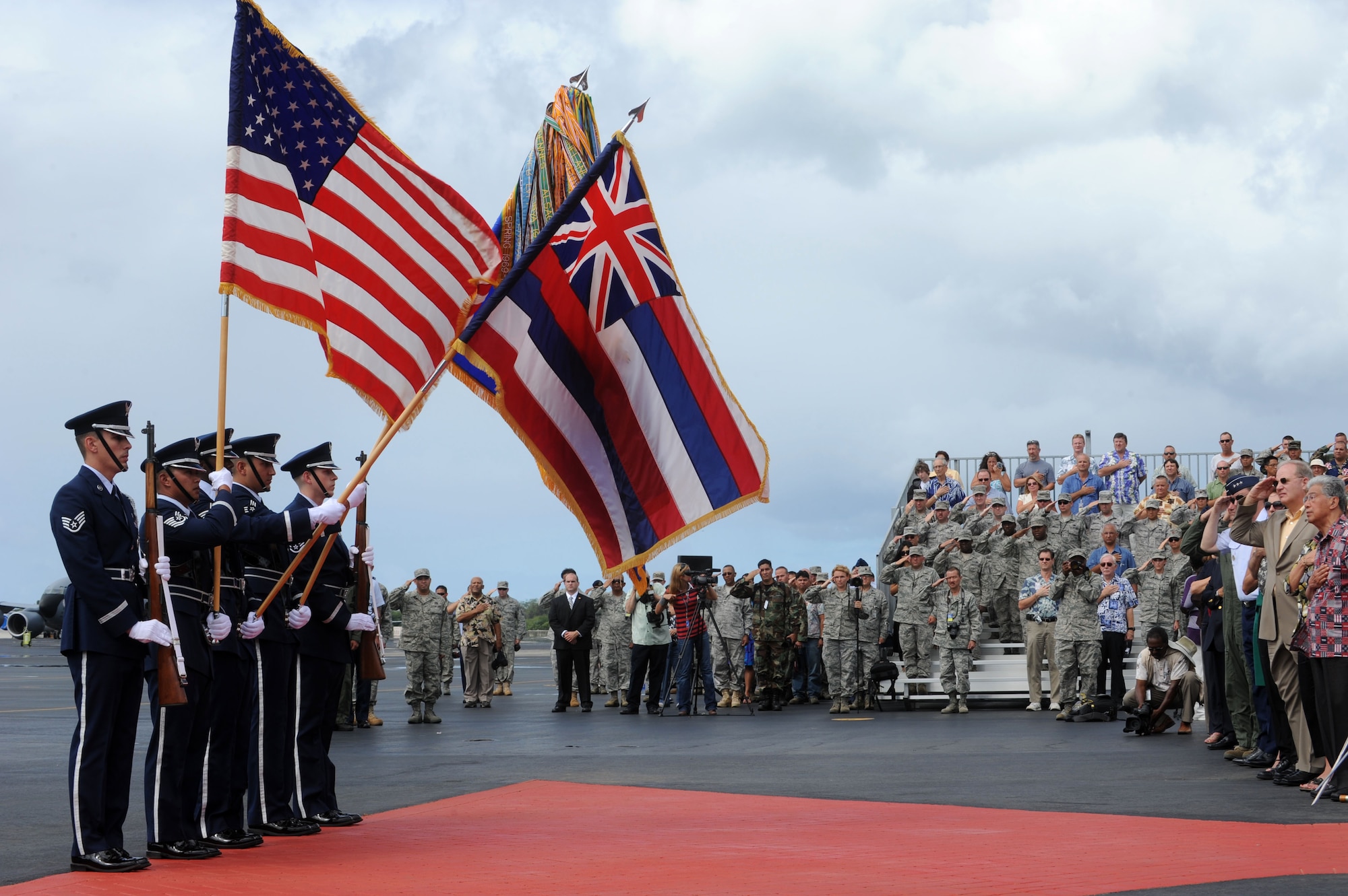 Hickam Honor Guard posts the colors during the F-22 Arrival Ceremony here, July 9. The F-22 Raptor is the Air Force's newest fighter aircraft. Its combination of stealth, supercruise, maneuverability, and integrated avionics, coupled with improved supportability, represents an exponential leap in warfighting capabilities. The ceremony marks the beginning of the partnership between the Hawaii Air National Guard and the active duty Air Force flying the “fifth generation” fighter at Hickam. The F-22 Raptors are assigned to the 199th Fighter Squadron, 154th Wing, Hawaii Air National Guard and the 19th Fighter Squadron, 15th Wing. (U.S. Air Force photo/Senior Airman Gustavo Gonzalez)
