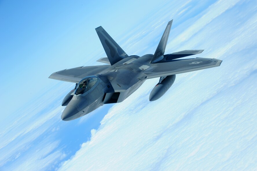 JOINT BASE PEARL HARBOR HICKAM, Hawaii ? An F-22 Raptor flies over the Pacific Ocean on its way to its new home, Joint Base Pearl Harbor Hickam, July 2. The 199th Fighter Squadron of the Hawaii Air National Guard is transitioning from the F-16 and will serve as the only Air National Guard led joint Guard and Active Duty squadron in the Pacific and the second in the U.S. Air Force. (U.S. Air Force photo/Senior Airman Gustavo Gonzalez)