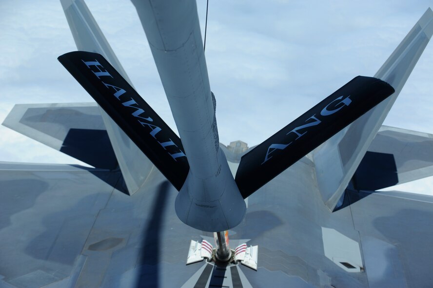 JOINT BASE PEARL HARBOR HICKAM, Hawaii ? A Hickam F-22 Raptor prepares to refuel over the Pacific Ocean on its way to Joint Base Pearl Harbor Hickam from a Hickam KC-135 Stratotanker assigned to the 199th Air Refueling Squadron, July 2. The 199th Fighter Squadron of the Hawaii Air National Guard is transitioning from the F-16 and will serve as the only Air National Guard led joint Guard and Active Duty squadron in the Pacific and the second in the U.S. Air Force. (U.S. Air Force photo/Senior Airman Gustavo Gonzalez)