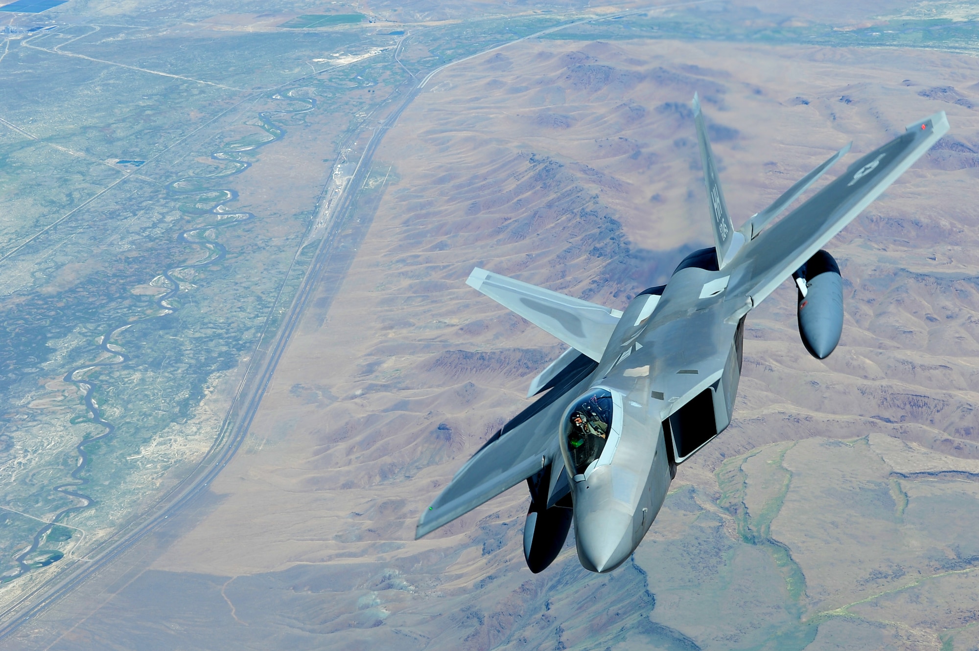 JOINT BASE PEARL HARBOR HICKAM, Hawaii ? An F-22 Raptor flies over the Pacific Ocean on its way to its new home, Joint Base Pearl Harbor Hickam, July 2. The 199th Fighter Squadron of the Hawaii Air National Guard is transitioning from the F-16 and will serve as the only Air National Guard led joint Guard and Active Duty squadron in the Pacific and the second in the U.S. Air Force. (U.S. Air Force photo/Senior Airman Gustavo Gonzalez)