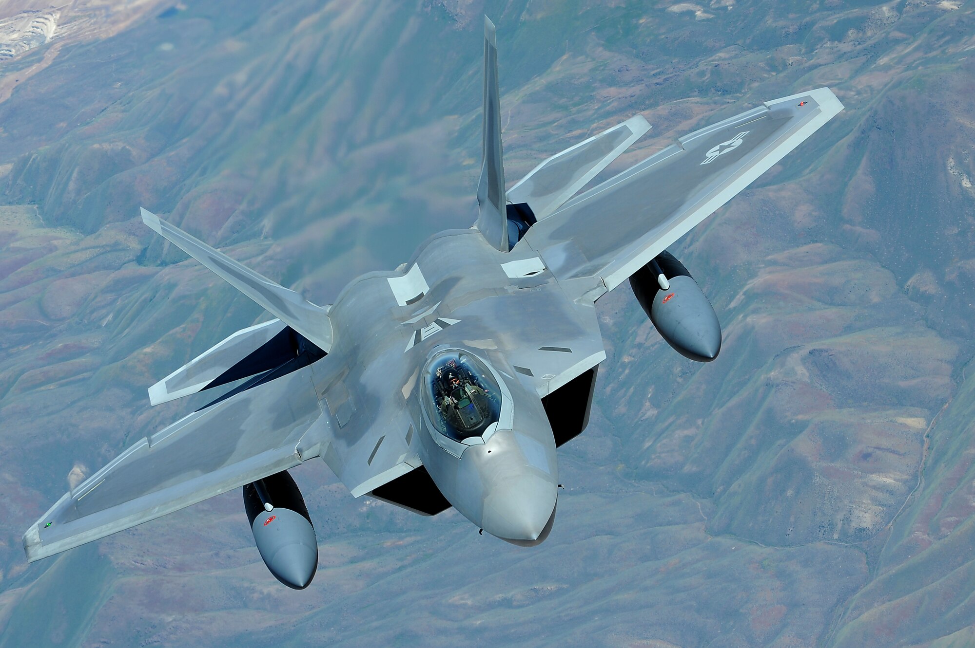 JOINT BASE PEARL HARBOR HICKAM, Hawaii ? An F-22 Raptor flies over the Pacific Ocean on its way to its new home, Joint Base Pearl Harbor Hickam, July 2. The 199th Fighter Squadron of the Hawaii Air National Guard is transitioning from the F-16 and will serve as the only Air National Guard led joint Guard and Active Duty squadron in the Pacific and the second in the U.S. Air Force. (U.S. Air Force photo/Senior Airman Gustavo Gonzalez)