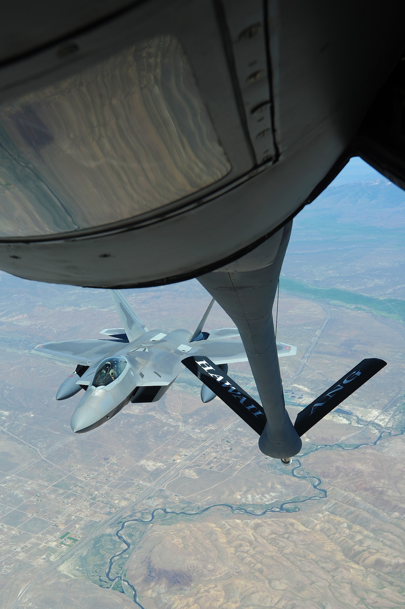 JOINT BASE PEARL HARBOR HICKAM, Hawaii ? A Hickam F-22 Raptor prepares to refuel over the Pacific Ocean on its way to Joint Base Pearl Harbor Hickam from a Hickam KC-135 Stratotanker assigned to the 199th Air Refueling Squadron, July 2. The 199th Fighter Squadron of the Hawaii Air National Guard is transitioning from the F-16 and will serve as the only Air National Guard led joint Guard and Active Duty squadron in the Pacific and the second in the U.S. Air Force. (U.S. Air Force photo/Senior Airman Gustavo Gonzalez)