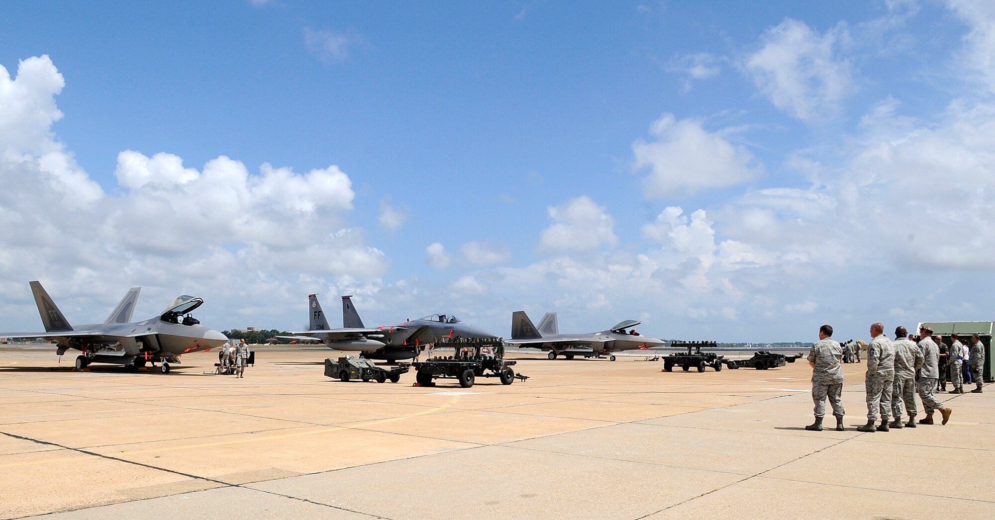 LANGLEY AIR FORCE BASE, Va.—Team Langley members show support for their squadrons during a weapons load crew of the quarter competition July 9. Weapons load crews from the 94th, 71st, and 27th Aircraft Maintenance Units competed in the competition to show which load crew is the best.  (U.S. Air Force photo/ Senior Airman Dana Hill)