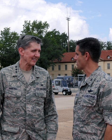 BARKSDALE AIR FORCE BASE, La. -- Lt. Gen. Richard Harding, Judge Advocate General, is greeted by Col. Steven Basham, 2d Bomb Wing commander, upon his arrival at Barksdale July 7. His visit was prompted by Article 6 of the Uniform Code of Military Justice, which dictates that he makes frequent inspections in the field. During his visit General Harding also met with legal professionals as well as senior leaders on base and emphasized on how important it is for a fair military justice system. (U.S. Air Force photo by Senior Airman La'Shanette V. Garrett)(RELEASED)