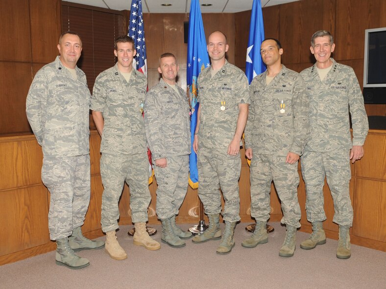 BARKSDALE AIR FORCE BASE, La. -- From left to right, Lt. Col. Steven Dubriske, Judge Advocate, stands next to members of 2d Bomb Wing Legal Capt. Matthew Heibel, Maj. William Deitch, Capt. John Goehring, Capt. Jesse Anderson and Lt. Gen. Richard Harding, the Judge Advocate General. General Harding presented medals to three captains and a major during his visit to Barksdale July 9. (U.S. Air Force photo by Senior Airman Alexandra M. Boutte) (RELEASED)