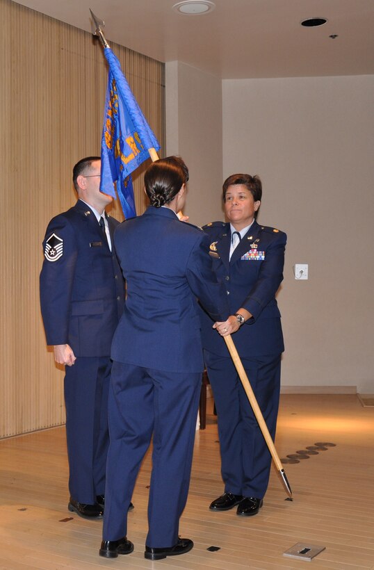 Maj. Heather Cook (right), takes command of the 82nd Logistics Readiness Squadron July 8, 2010, during a change of command ceremony in the Bldg. 1900 auditorium. Col. Kimberley Ramos (center), 82nd Mission Support Group commander, officiated the ceremony. Major Cook came from the Pentagon where she served as the chief logistics readiness officer, education and training, directorate of logistics, deputy chief of staff for logistics and installations and mission support. (U.S. Air Force photo/Airman 1st Class Adawn Kelsey)