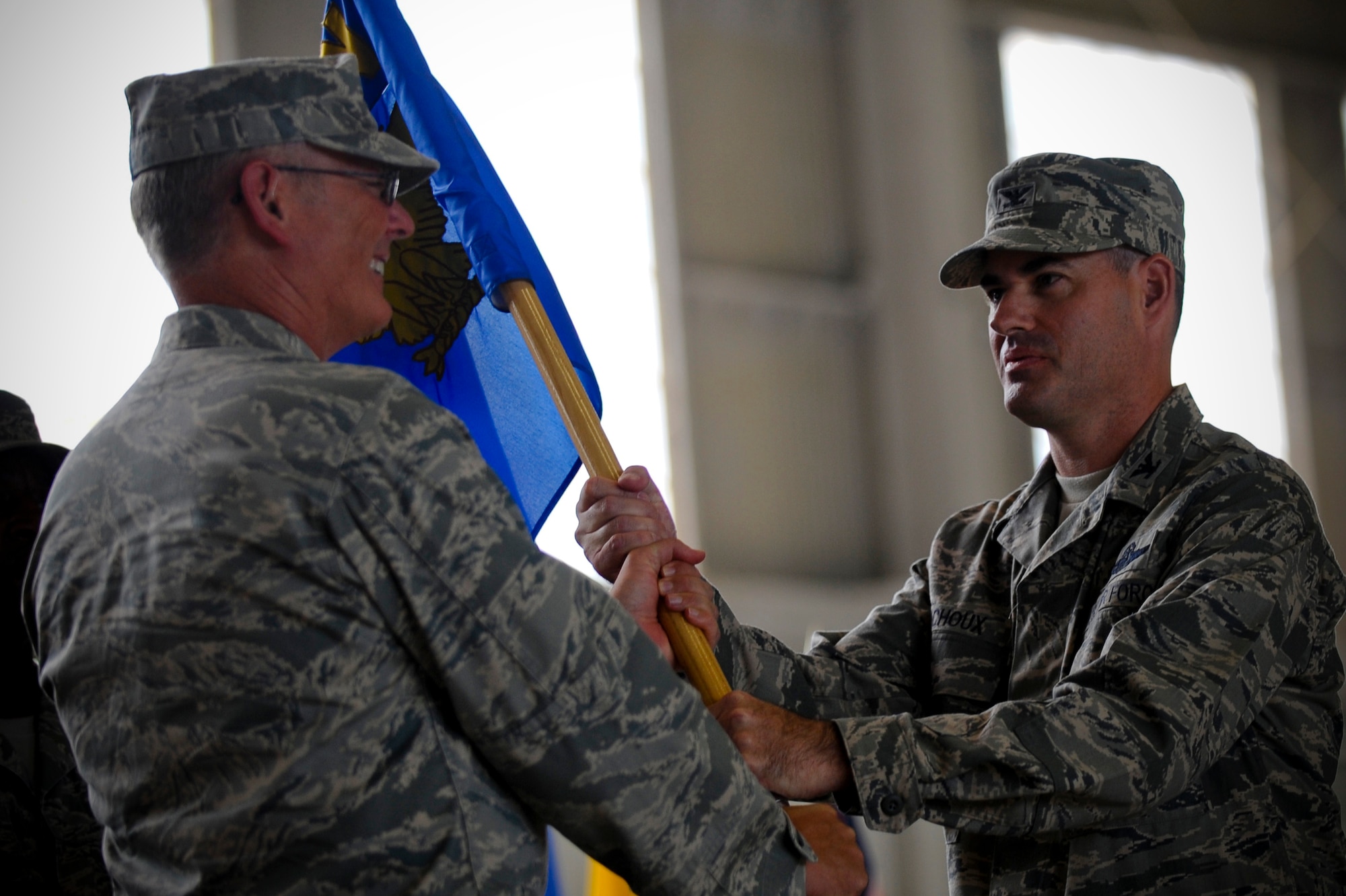 Lt. Gen. Robert R. Allardice(left), 18th Air Force Commander, hands the 6th Air Mobility Wing guidon to Col. Lenny J. Richoux during a change of command ceremony at MacDill Air Force Base, July 9, 2010. The guidon being passed to the individual assuming command is a symbolic tradition and a part of military history.
(U.S. Air Force photo by Staff Sgt. Joseph L. Swafford Jr./Released)