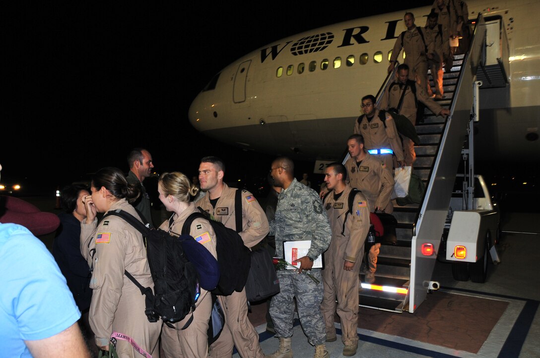 Servicemembrs from the 21st Airlift Squadron are greeted July 3 by Travis senior leadership and families after a four month deployment in support of Operation Iraqi and Enduring Freedom. (U.S. Air Force photo/Tech. Sgt. Lesley Waters.)