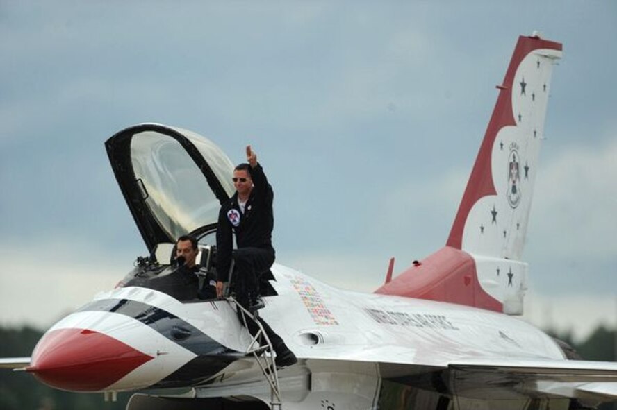 A pilot for the USAF Thunderbirds thanks the crowd before a performance durring and air show at Columbus AFB.  The Thunderbirds witll be attending the Wings Over Pittsburgh air show September 11th, and 12th, 2010 (US Air Force Courtesy Photo).