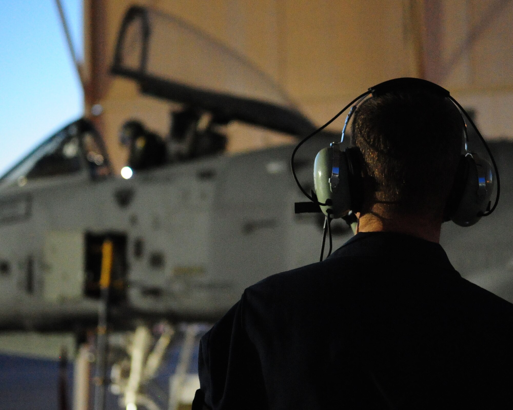 Airman 1st Class Jeff Gronemyer, an A-10C crew chief from the 355th Aircraft Maintenance Squadron, stands by as 1st Lt. Dan Griffin performs his final operations check prior to departing for a mission June 23. This was the second of eight night flights for Lieutenant Griffin, who is currently a student in the A-10C Pilot Initial Qualification course. As part of the A-10C Pilot Initial Qualification course curriculum, he needed to learn how to execute night flying missions. He accomplished this through six hours of academic classes, five hours in the A-10 FMT, also known as a simulator, and eight flights. (U.S. Air Force photo/Airman 1st Class Jerilyn Quintanilla)