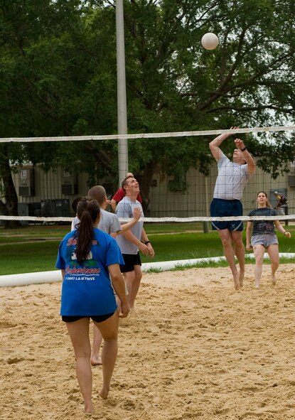 BARKSDALE AIR FORCE BASE, La. -- A Barksdale Airman goes up to spike the volleyball during 2d Bomb Wing Sports Day July 1. Sports Day consists of many team sports such as basketball, flag football, dodge-ball, tug-of-war and many others. (U.S. Air Force photo by Senior Airman Chad Warren) (RELEASED)