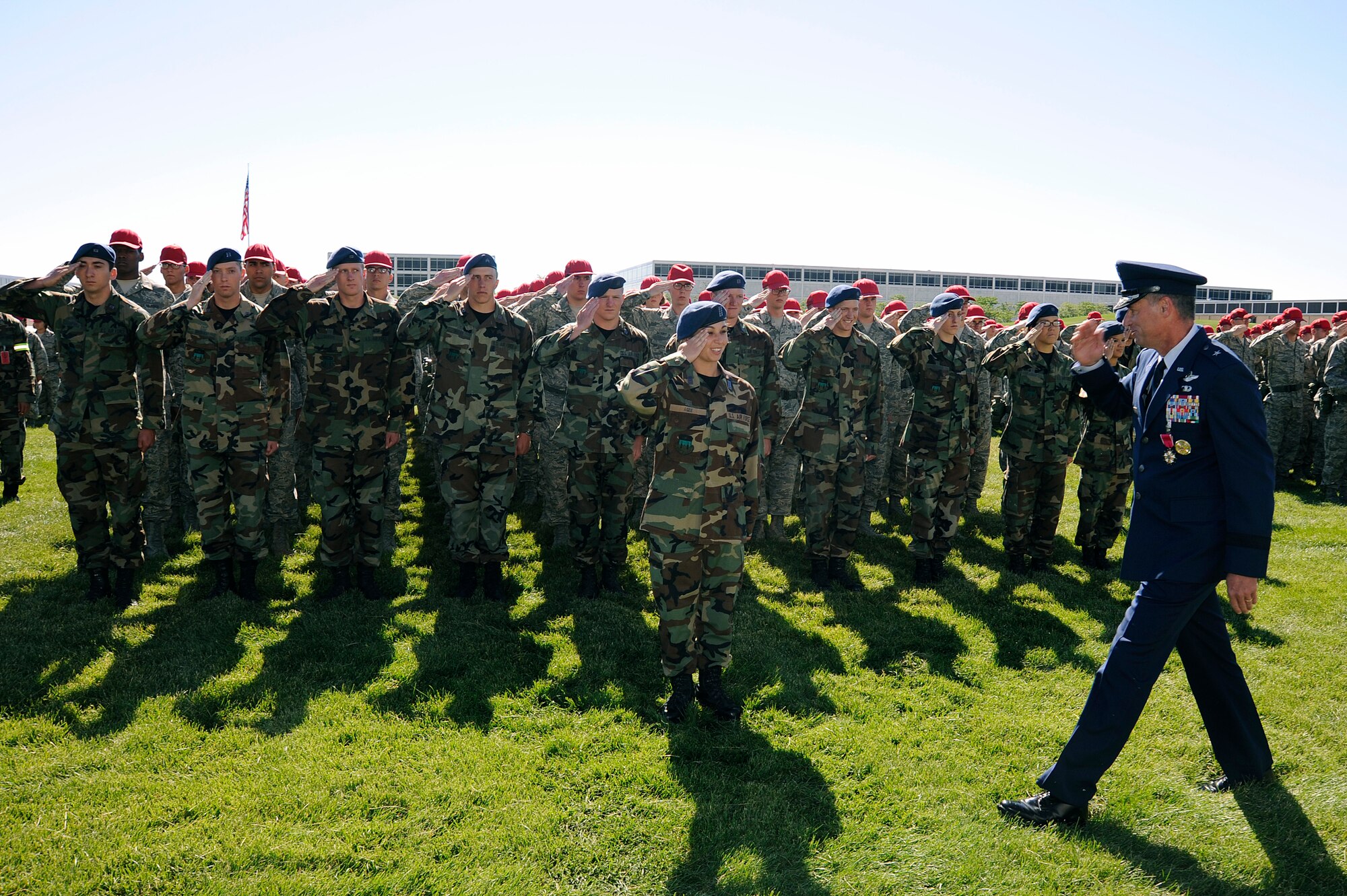 Cadets led by Cadet 1st Class Chelsea Agee of Cadet Squadron 35 render a final salute to Brig. Gen. Sam Cox during the commandant of cadets' change-of-command ceremony at the Air Force Academy in Colorado Springs, Colo., July 9, 2010. General Cox is selected to assume command of Air Mobility Command's 618th Tanker Airlift Control Center at Scott Air Force Base, Ill. His successor as commandant is Brig. Gen. Richard Clark, former vice commander of 8th Air Force (Air Forces Strategic) at Barksdale AFB, La. (U.S. Air Force photo/Mike Kaplan)