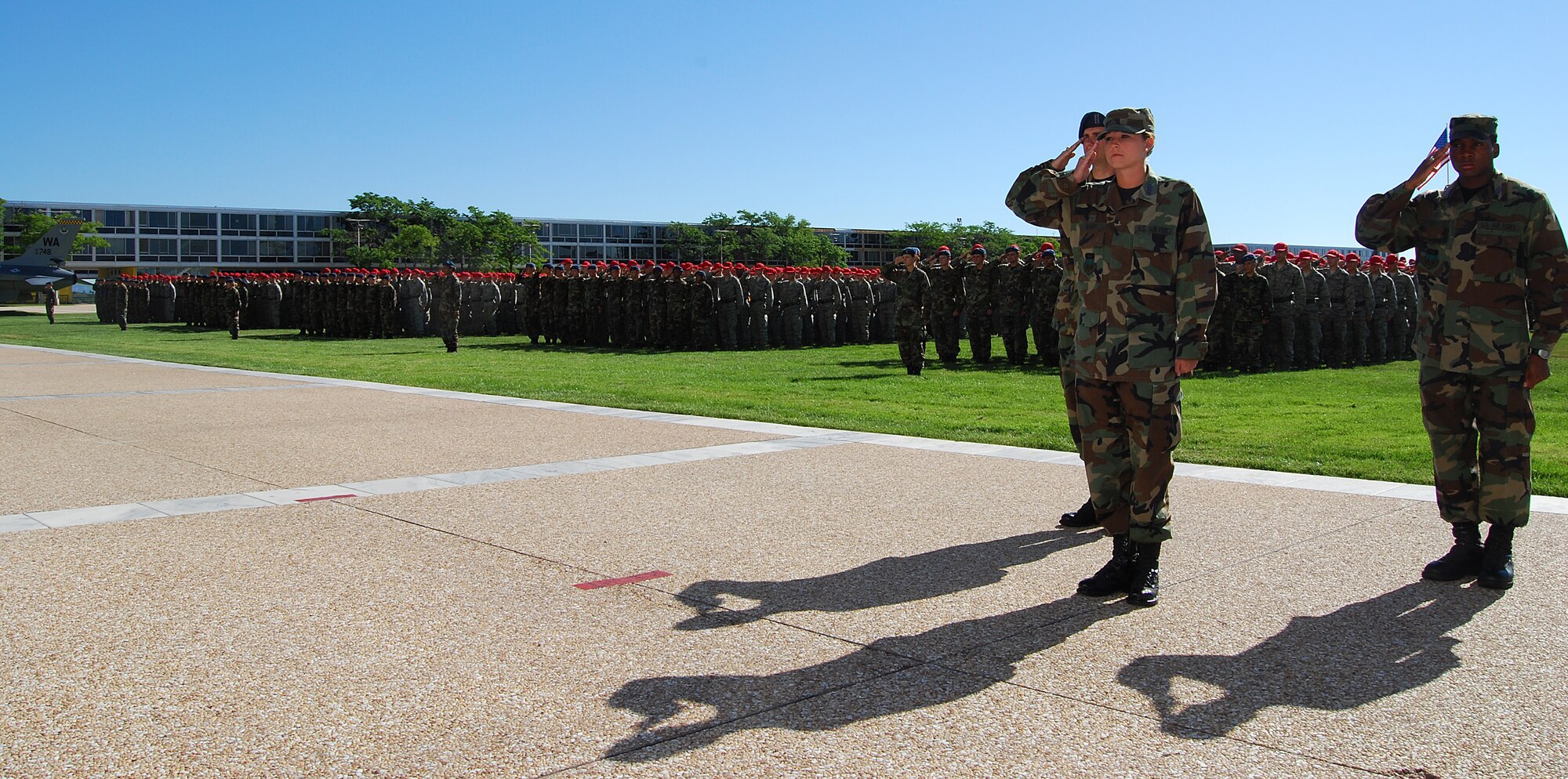 The Cadet Wing, led by Cadet 1st Class Megan Hoskins, salutes during the national anthem at the commandant of cadets' change-of-command ceremony at the Air Force Academy in Colorado Springs, Colo., July 9, 2010. Brig. Gen. Richard Clark, the former vice commander of 8th Air Force (Air Forces Strategic) at Barksdale Air Force Base, La., succeeded Brig. Gen. Sam Cox as commandant.