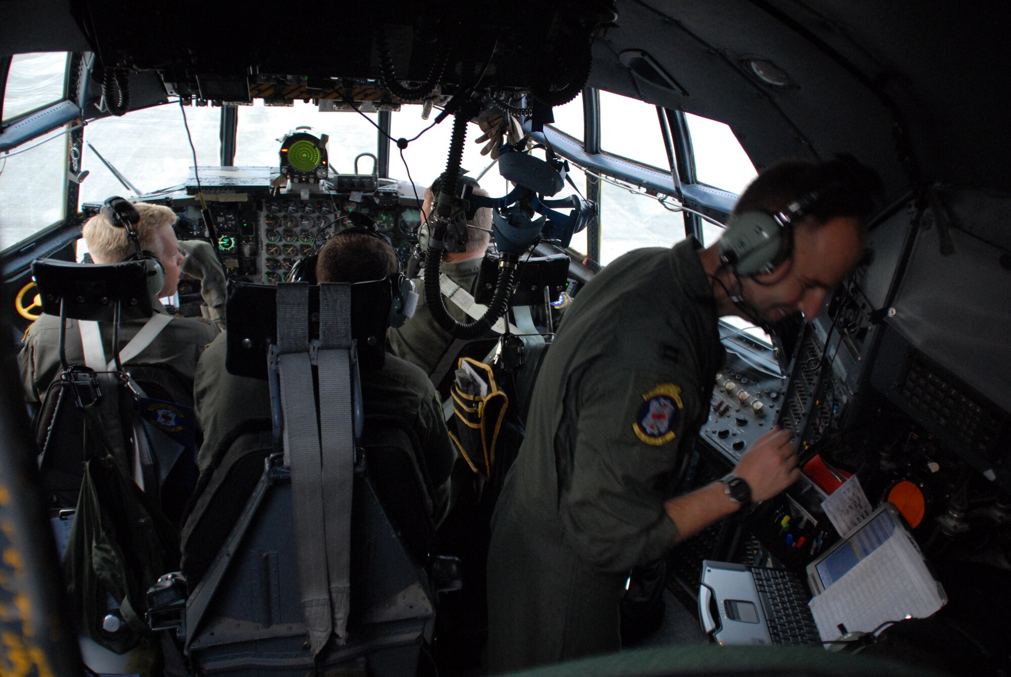 Members of a C-130E crew from the 53rd Airlift Squadron, Little Rock A.F.B. (from the left) Maj. Lars Johnsen, aircraft commander, Staff Sgt. Thomas J. Brown, flight engineer, Capt. Jason Robinson, copilot, Capt. Brian Shea, instructor navigator, and 1st Lt. Stefan Idso, navigator, prepare for their second mission part of an 18-ship formation that flew as part of a Joint Forcible Entry Exercise June 22 and 23 at Pope A.F.B. and Fort Bragg, N.C. The formation was the largest formation ever assembled for a JFEX. (U.S. Air Force photo by Capt. Joe Knable)