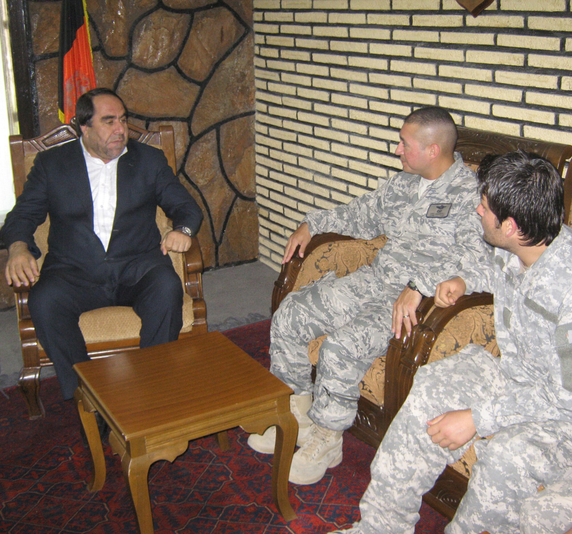 Panjshir Gov. Keramuddin Keram (left) talks with Lt. Col. Curtis Velasquez July 1, 2010 about a project that could bring 35,000 new trees into the province by the end of the year. Colonel Velasquez is the Provincial Reconstruction Team Panjshir commander. (U.S. Air Force Photo/2nd Lt. Jason Smith)