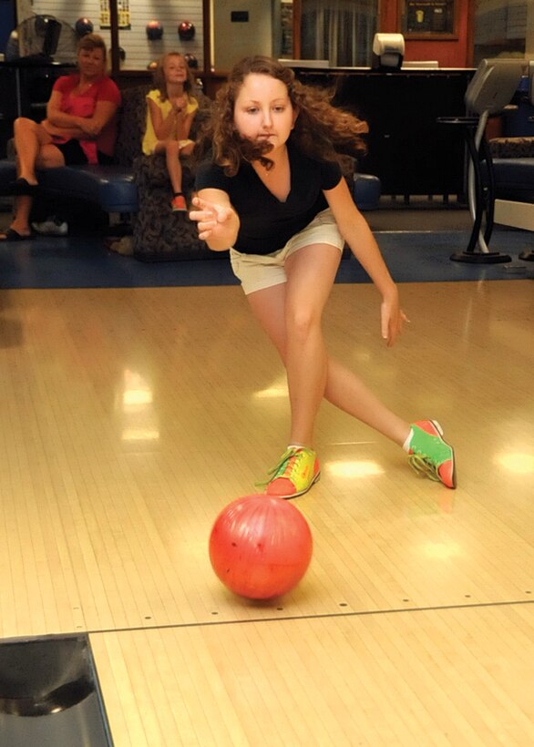 JOINT BASE ANDREWS, Md. -- Kelly Kampsen, 16, bowls a leisure game with her siblings at the Andrews Bowling Center July 7. Kelly is the daughter of Lt. Col. Chris Kampsen, 99th Airlift Squadron pilot. Colonel Kampsen is deployed to Afghanistan in support of Operation Enduring Freedom.  (U.S. Air Force photo by Bobby Jones)