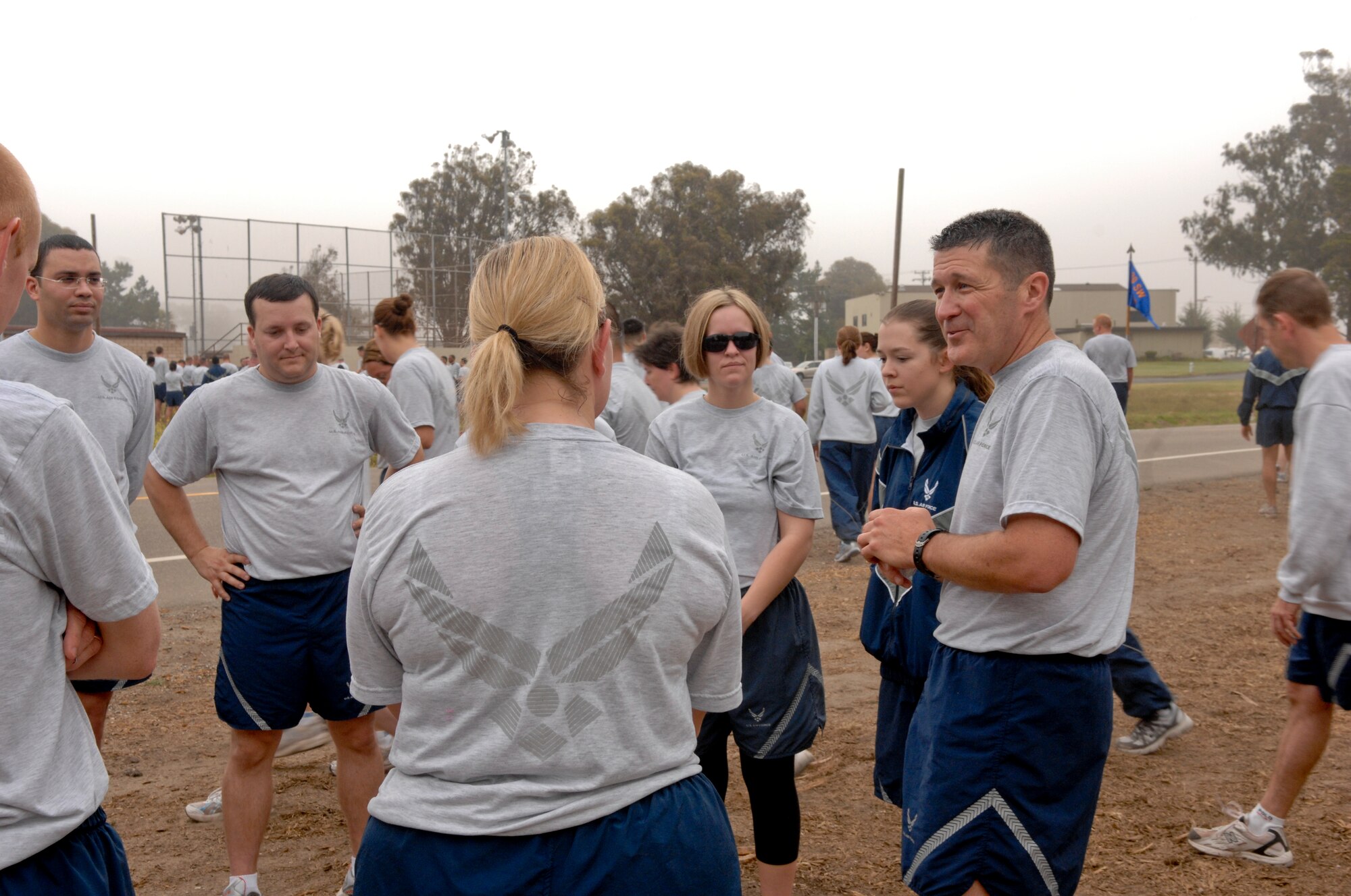 VANDENBERG AIR FORCE BASE, Calif. -- Lt. Col. Charles Vogt (far right), 30th Operation Support Squadron commander, speaks with members of the 30th OSS concerning holiday safety after the Fit-to-Fight run here Wednesday, June 30, 2010.  The run is Vandenberg’s way of holding its Airmen to a high standard of physical fitness each month. (U.S. Air Force photo/Staff Sgt. Levi Riendeau)